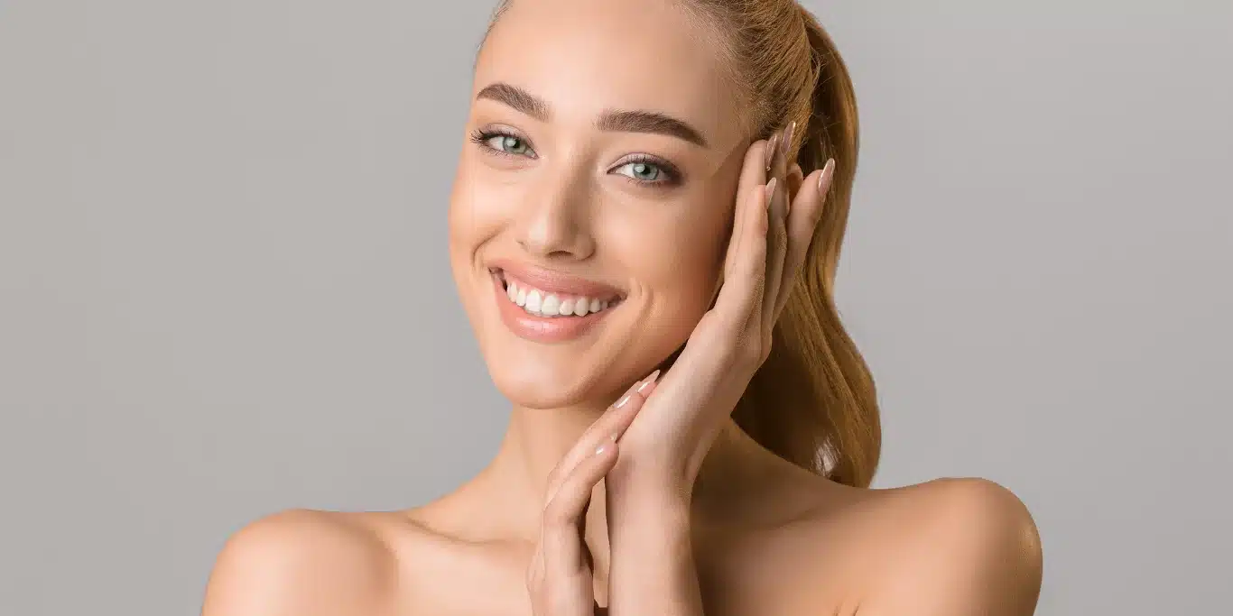 beautiful smiling woman touching her face beautiful smiling woman touching her face